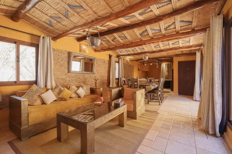 Bungalow 185 at golden hour — cedar ceilings, tadelakt walls, and a window that finally exhales.